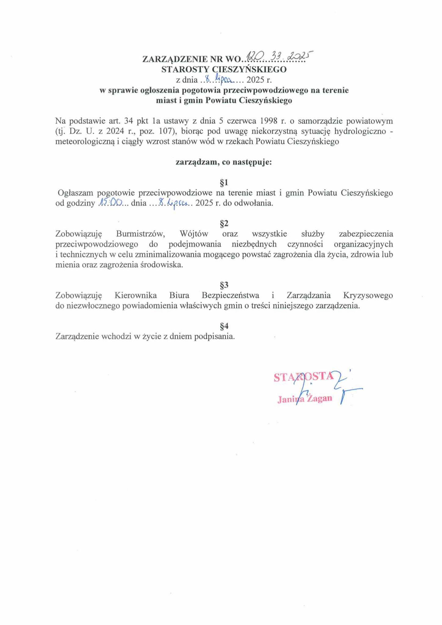 Dokument urzędowy z podpisem Janiny Żagan ogłaszający od 8 lipca 2025 r. pogotowie przeciwpowodziowe w miastach i gminach Powiatu Cieszyńskiego. Widoczny jest tekst zarządzenia i pieczęć starosty.