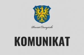 Grafika przedstawia herb Powiatu Cieszyńskiego oraz duży napis "KOMUNIKAT" na szarym tle. Sugeruje oficjalne ogłoszenie lub informację urzędową związaną z tym Powiatem.Grafika przedstawia herb Powiatu Cieszyńskiego oraz duży napis "KOMUNIKAT" na szarym tle. Sugeruje oficjalne ogłoszenie lub informację urzędową związaną z tym Powiatem.