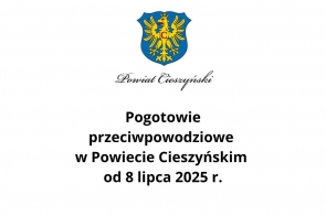 Herb Powiatu Cieszyńskiego z orłem na niebieskim tle umieszczony nad napisem informującym o ogłoszeniu pogotowia przeciwpowodziowego w Powiecie Cieszyńskim od 8 lipca 2025 roku.